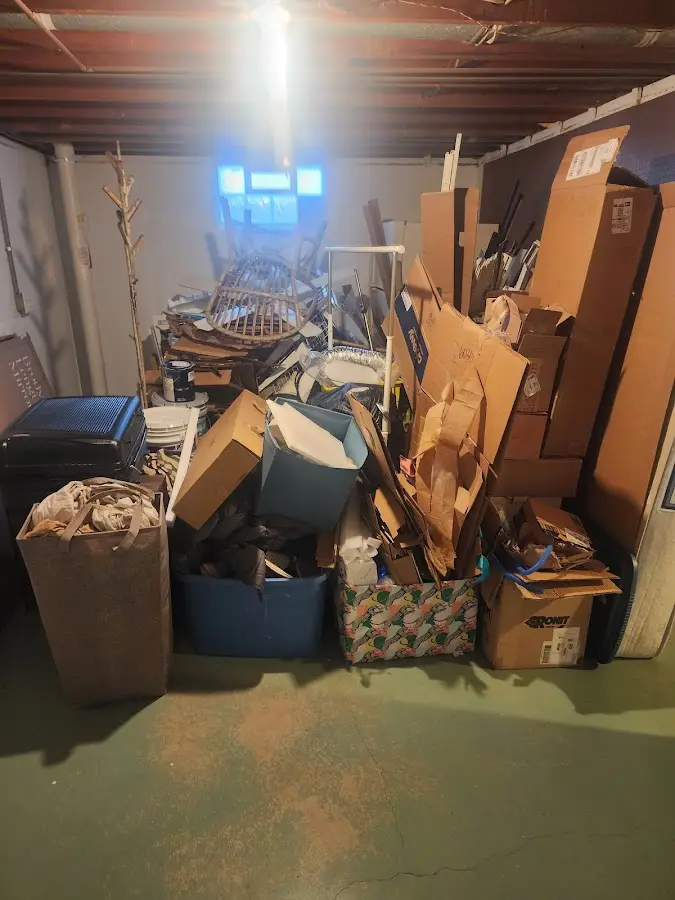 Roll-off dumpster container at job site for 2 Yard Dumpster Rental in Erwin